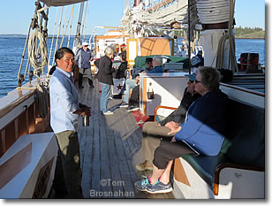 Passengers aboard windjammer Victory Chimes with morning coffee, Maine