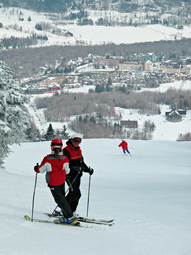 Skiers overlooking Stratton Village, Vermont